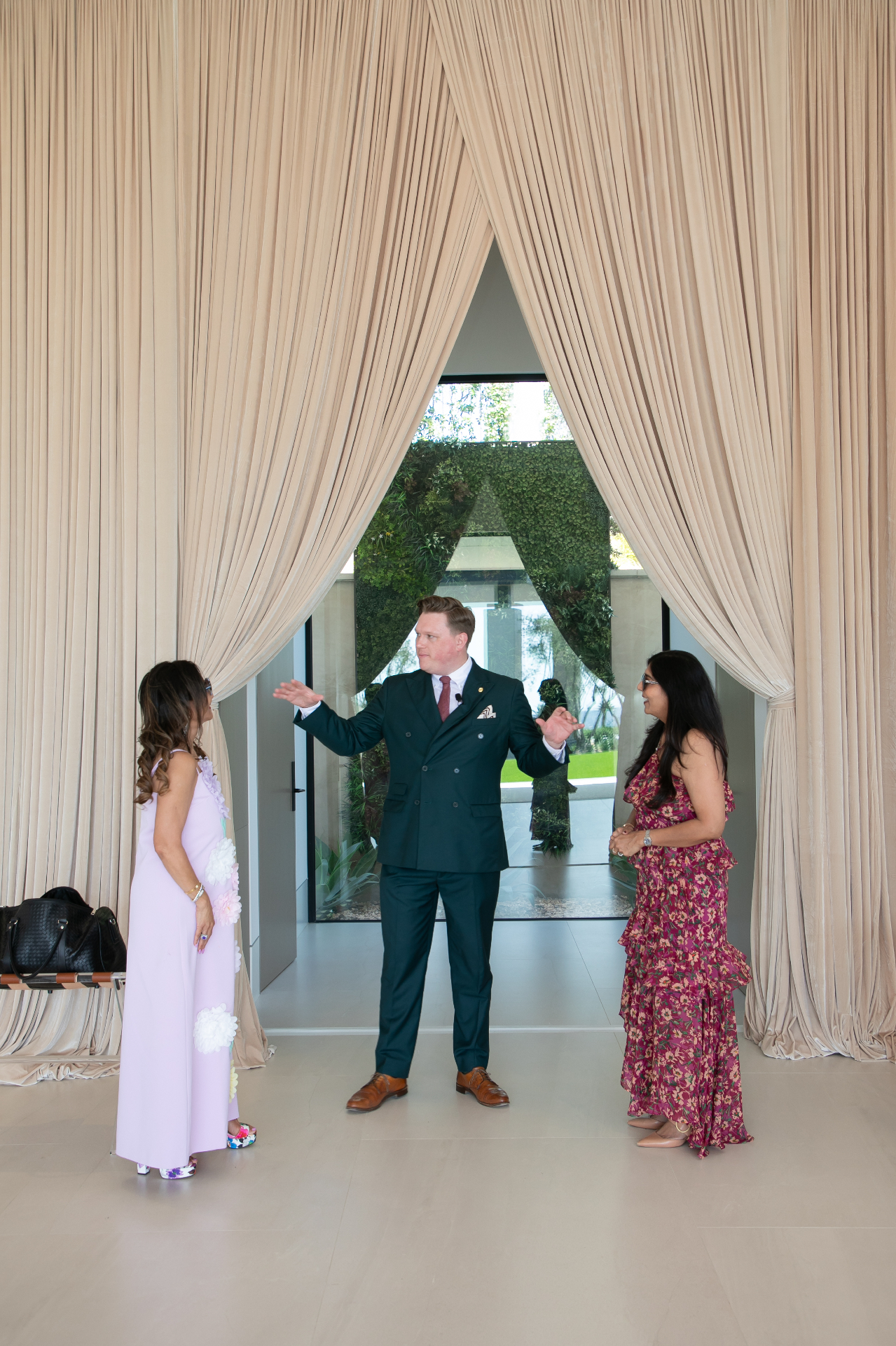 Scott Syme greeting guests at a luxury ladies' luncheon private event