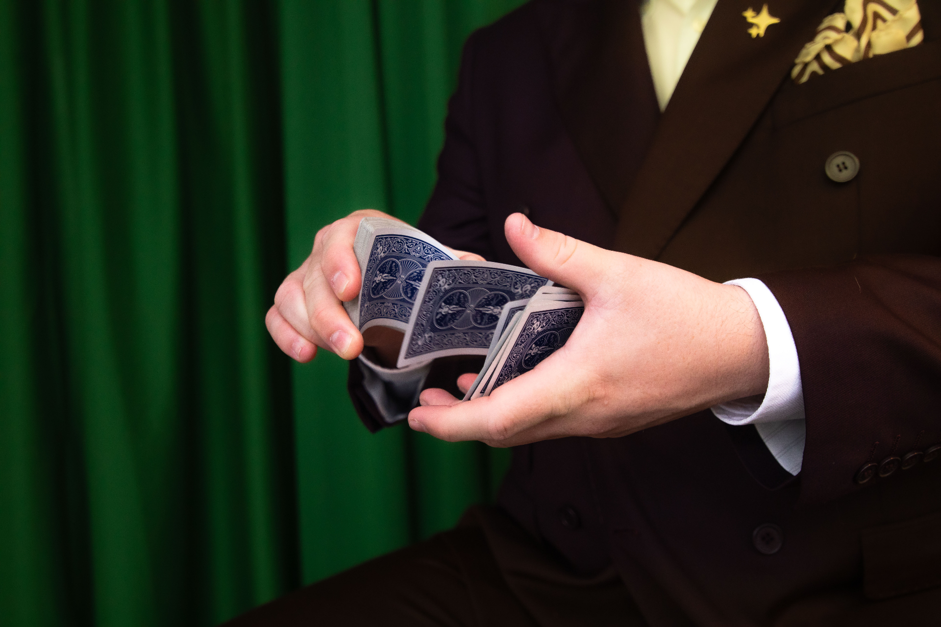 Close-up card handling at a corporate entertainment event