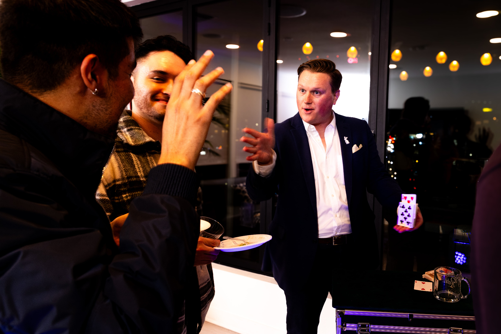Scott Syme performing card magic at a private luxury event