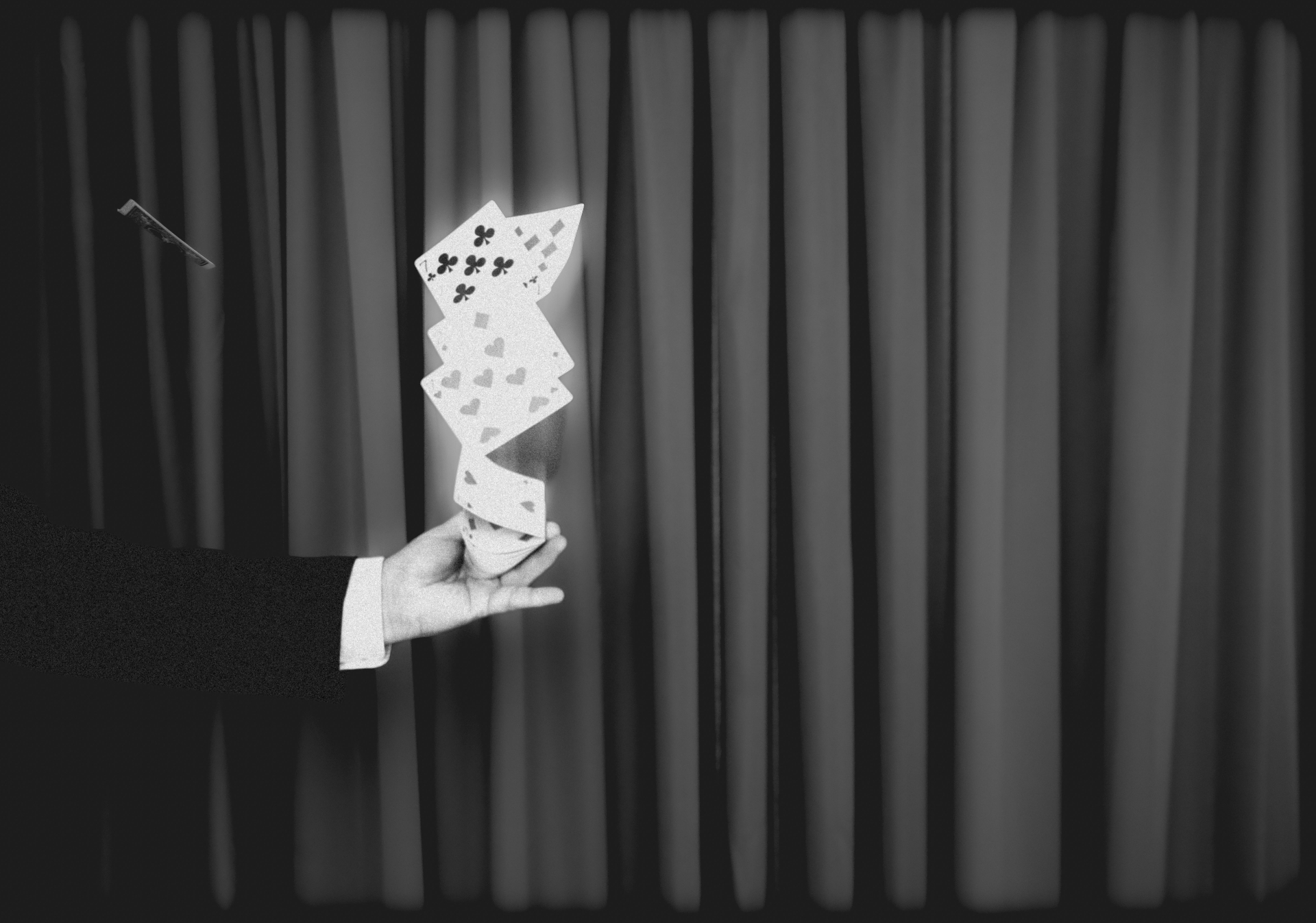 Card stack flourish with emerald curtain backdrop